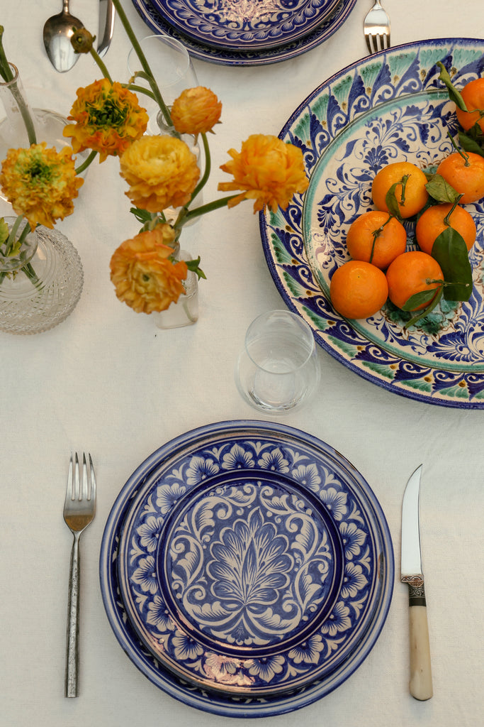 table with Set of Four Uzbek Handmade Ceramic Dinner plates – Dark Blue
