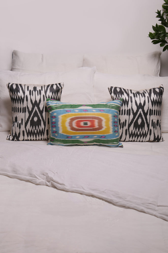 Silk Ikat Cushions on a bed setting